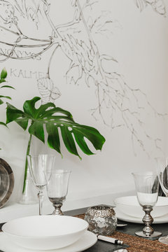 Close-up of served dining table with plant