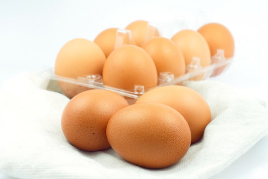 Stack brown egg on white background