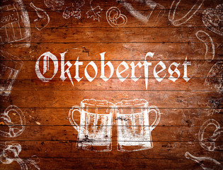 Oktoberfest sign, beer mugs, chalk drawings, wooden background