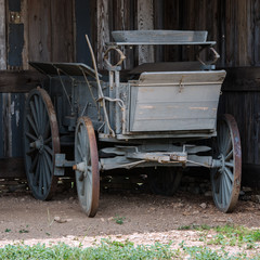 Old horse drawn carriage in a barn