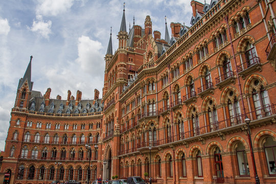 The curved facade of The St Pancras Renaissance Hotel in London showing the grand, Gothic architectural detail.