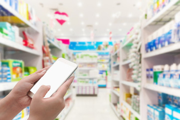 Hand young women using smart phone on pharmacy