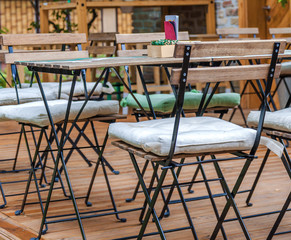 Wooden table and chair in the cafe garden