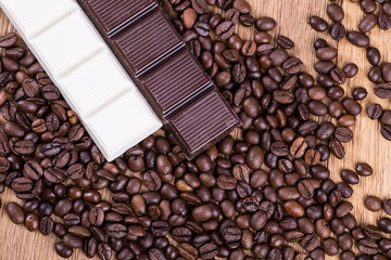coffee beans and chocolate on a wooden background