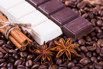 coffee beans and chocolate on a wooden background