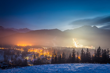 Skiing competitions in Zakopane in winter at dusk, Poland - obrazy, fototapety, plakaty