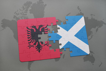 puzzle with the national flag of albania and scotland on a world map background.