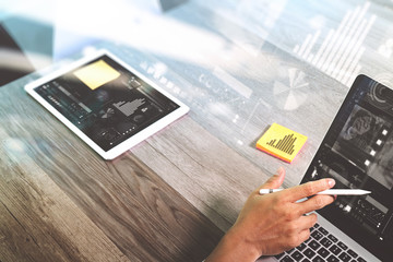 businessman hand working with stylus pen memo papters digital ta