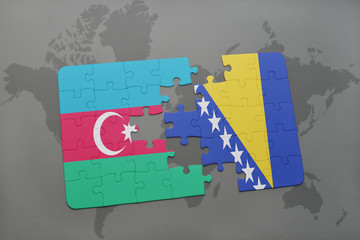 puzzle with the national flag of azerbaijan and bosnia and herzegovina on a world map background.