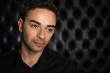 Fototapeta premium Man portrait on black background