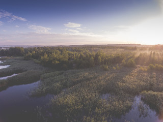 Sunraise morning summer time lake and green forest, in Poland la