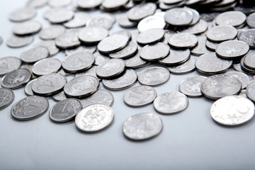 pile of coins on a white