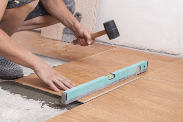 laying tiles on the floor