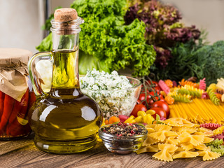 The composition of the pasta and vegetables on a wood background