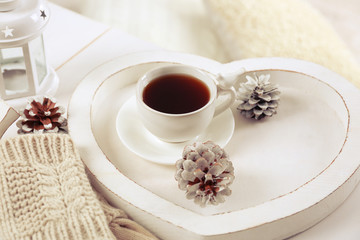 Beautiful winter composition with cup of hot drink