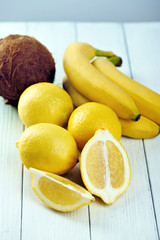 Topical fruits on a white wooden table