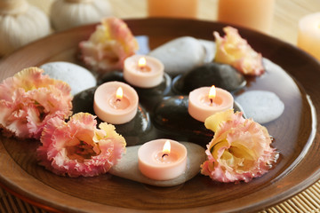Beautiful spa composition with bowl and flowers