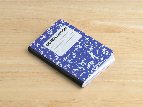 Blue composition notebook on a table.