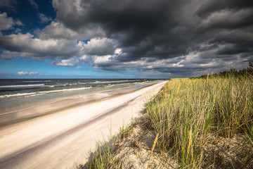 A view of beautiful sandy beach in Leba town, Baltic Sea, Poland - obrazy, fototapety, plakaty