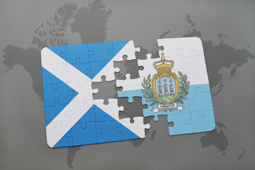 puzzle with the national flag of scotland and san marino on a world map background.