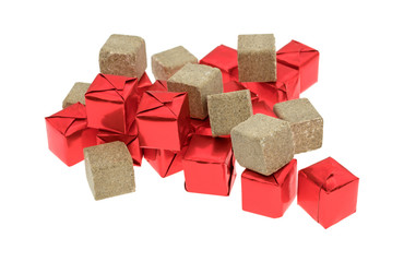 Beef flavored bouillon cubes wrapped and unwrapped on a white background.