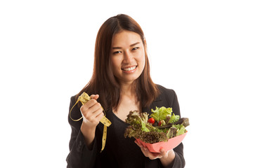 Healthy  Asian business woman with measuring tape and salad.