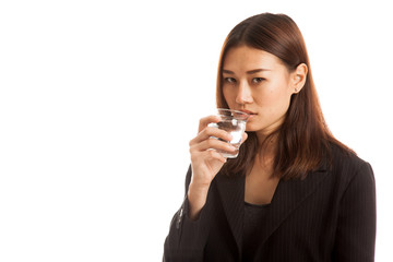 Young Asian woman with a glass of drinking water.