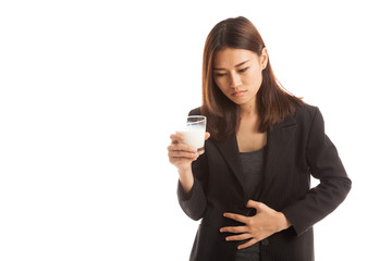 Asian woman drinking a glass of milk got stomachache.