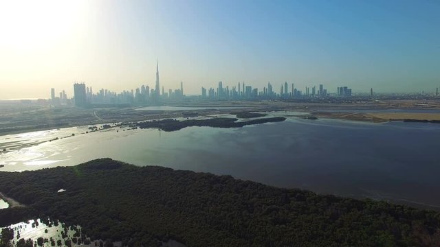 Aerial view Dubai horizon panorama cityscape from Ras Al Khor video 4k. Skyscrapers modern buildings Travel tourism business in United Arab Emirates