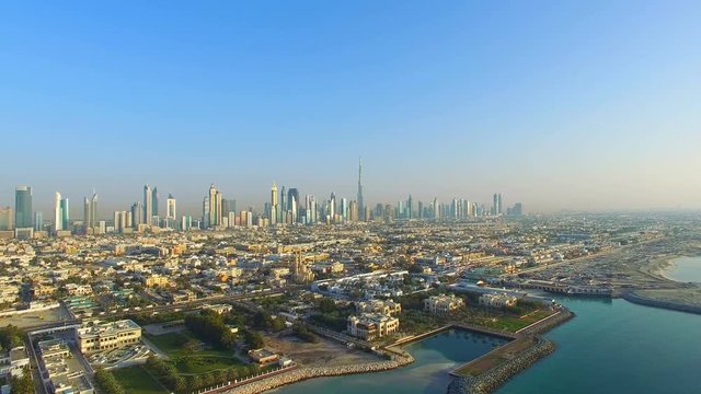 Aerial view Dubai downtown horizon panorama cityscape from Maritime city video 4k. Skyscrapers modern buildings Travel tourism business in United Arab Emirates