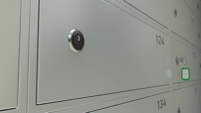 Safe deposit boxes in a bank and the key. Shallow focus 4K dolly shot