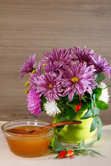 Flower honey and bouquet of dahlias