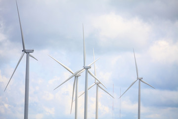 Fototapeta premium Wind turbines with the clouds and sky
