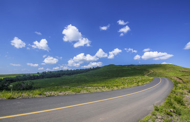 Fototapeta premium empty asphalt road on grassland