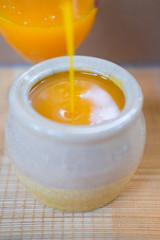 orange juice poured into a jar