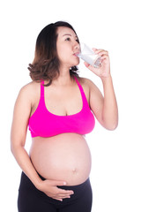 pregnant woman drink water from a glass isolated on white