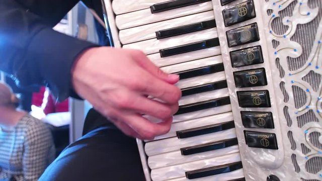 a man plays accordeon