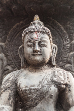 A stone carving of a buddha in Nepal.