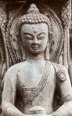 A stone carving of a buddha in Nepal.