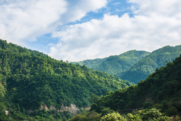 Naklejka premium The Rishikesh Valley from the Lakshman Jhula iron suspension bridge across the River Ganges in the holy city of Rishikesh, North India.