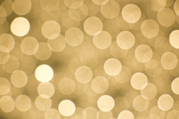 Glowing golden bokeh background for designing purposes