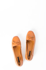 Beautiful vintage Pair of fashion woman leather shoes with top view profile and copy space, isolated on white background.