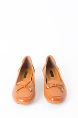 Beautiful vintage Pair of fashion woman leather shoes with front view profile and copy space, isolated on white background.