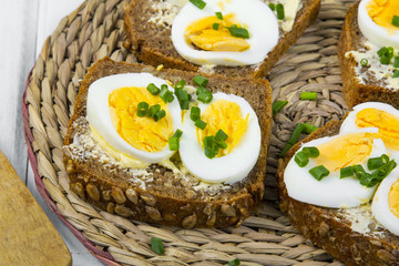 Healthy whole wheat sandwiches with eggs and chives