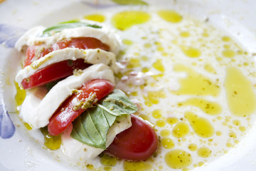 Fresh caprese salad with mozzarella basil and tomatoes