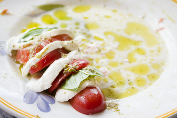 Fresh caprese salad with mozzarella basil and tomatoes