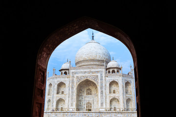 Fototapeta na wymiar The Taj Mahal seen through a black archway.