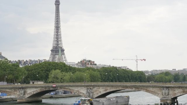 French famous Eiffel tower near river Seine by the day slow tilt 4K 2160p 30fps UltraHD video - Tilting on famous scenery of France and Paris 4K 3840X2160 UHD footage 