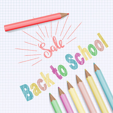 Back to school text on checkered notebook background.