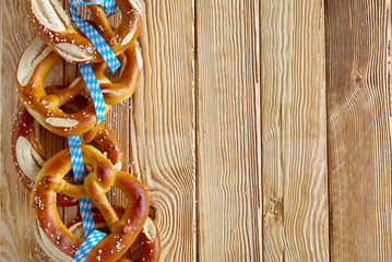Border of traditional Bavarian pretzels with bows